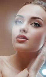 a woman with ring and large round diamond earrings