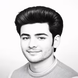 a black and white photo of a man with hair