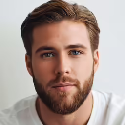 a man in white t - shirt sitting down