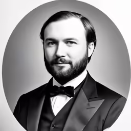 a man wearing a suit and bow tie
