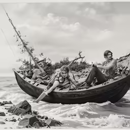 two people in a rowboat with two others