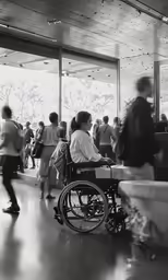 a woman in a wheel chair with lots of people behind her
