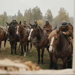 some men are on brown horses while the other horse is riding