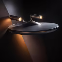 a modern bathroom light with a black surface