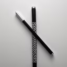 two pen laying side by side on the table