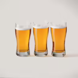 four glass cups are next to each other on a white background