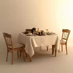 two chairs and a table with a white cloth on it