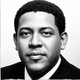 a black man in a suit and tie