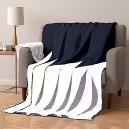 a living room with a couch and a white chair