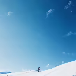 a person on skis is traveling on the snow