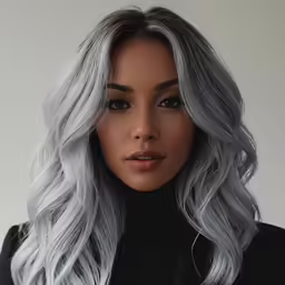 a gray long haired woman wearing black clothing