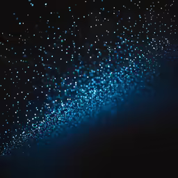 blue bubbles are falling in the dark