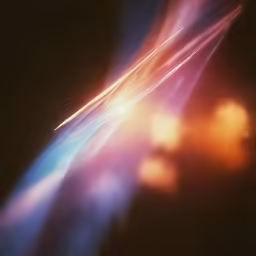 several lights shining from behind a very long bright object