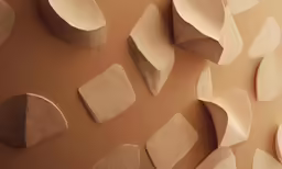 a close up view of a pattern of tan and beige material