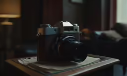 a camera is on top of a coffee table