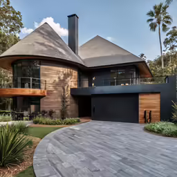 this is a modern day house with large driveway