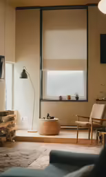 this living room is empty except for the window and chair