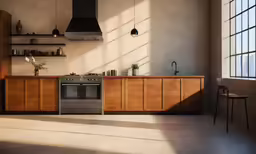 a kitchen with a stove and a wall mounted hood