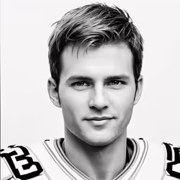 a close up of a man wearing a football uniform