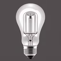 an illuminated light bulb on top of a table