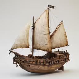 a boat model with sails on the white surface