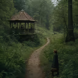 a woman is walking towards a small gazebo