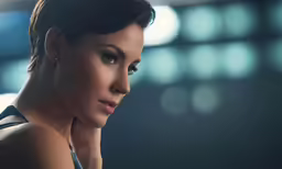 an attractive woman is posing for the camera