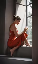 a woman sitting on steps reading a book