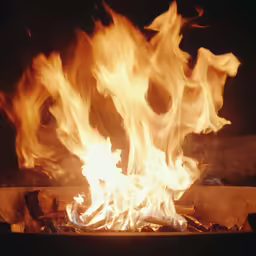 a close up of the flames of a bbq