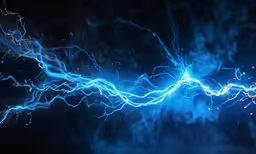 blue and yellow electrical lines are seen against a dark sky