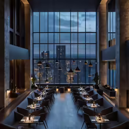 a dining room with chairs and a view