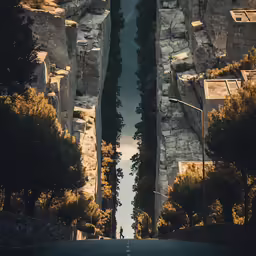 this is a photo of two narrow roads that is in the woods