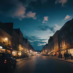 a long street lined with shops under cloudy skies