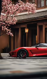 a red car sitting on top of a driveway