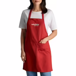 the woman in a red apron stands in front of a white background