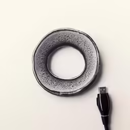 the cable is plugged into the device on a table