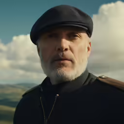 a close up of a person wearing a hat