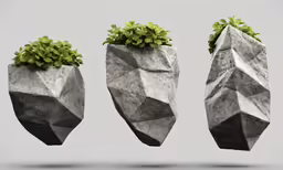 three rock planters one is gray and the other is grey and green