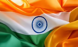the indian flag that is being flown on top of a cloth