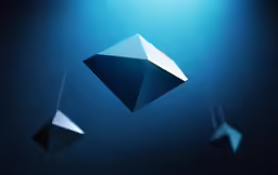three suspended shapes on blue lights above them
