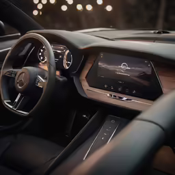the interior of a car with an all - wood steering wheel and touchscreen