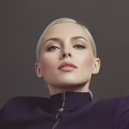 the woman with blond hair is wearing purple shirt