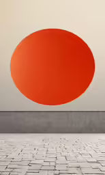 an abstract photo of an orange circle with a white wall