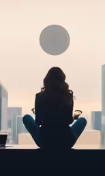 the woman sitting in a room watching something from the window