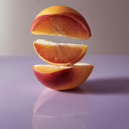 an apple that is cut in half and being peeled