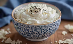 the bowl has a big pile of whipped cream