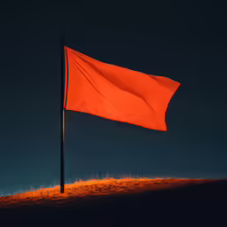 a red flag is blowing in the dark