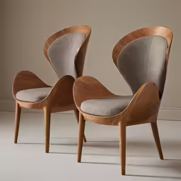 two modern lounge chairs in different colors and shapes