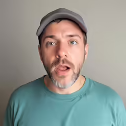 a man making a funny face as he poses for the camera