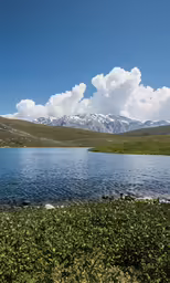 a view of a very pretty blue body of water